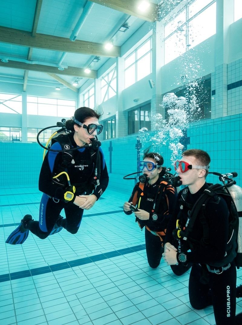 Small group scuba pool training session in heated Raleigh indoor pool